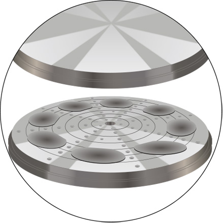 A series of sliced computer disc wafers placed on a rotary grinding table for the lapping process