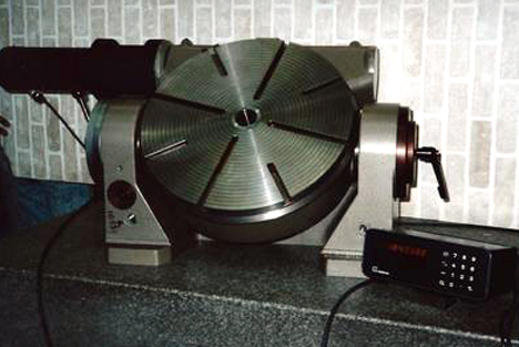 A rotary grinding table engineered for achieving variable angled grinding